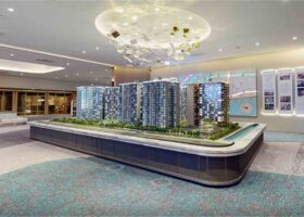 Grand Dunman showflat scale model displaying the seven residential towers and site layout beside Dakota MRT in District 15