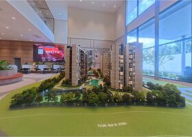 The SEN showflat scale model showcasing residential blocks, facilities layout, and site planning along Jalan Jurong Kechil